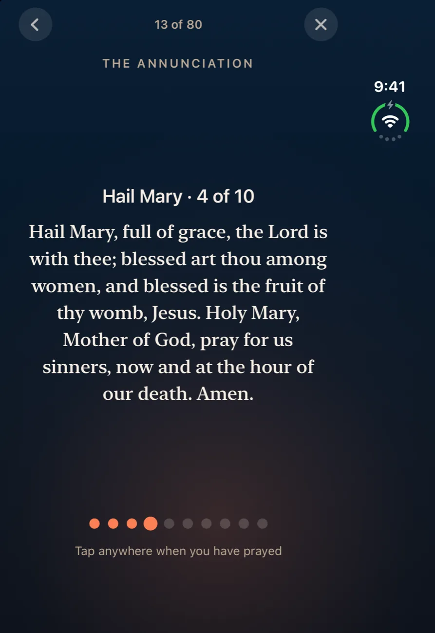 Ember on iPhone Duo closed outer display showing the Rosary: the fourth Hail Mary of the Annunciation decade with its beads counted below.